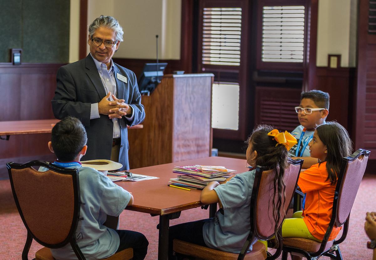 Professor teaching young students 